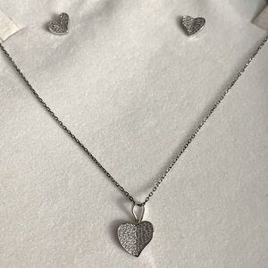 Silver diamond cut heart pendant and matching earrings.
